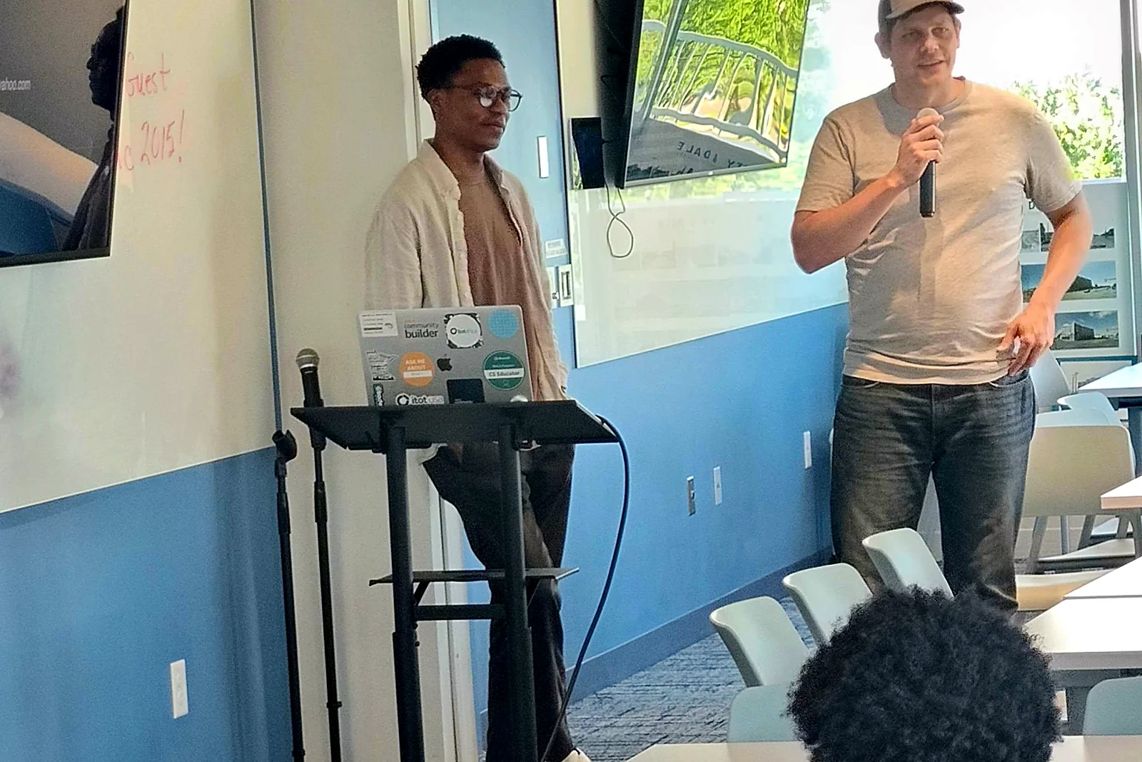Guest speakers addressing an Okademy class