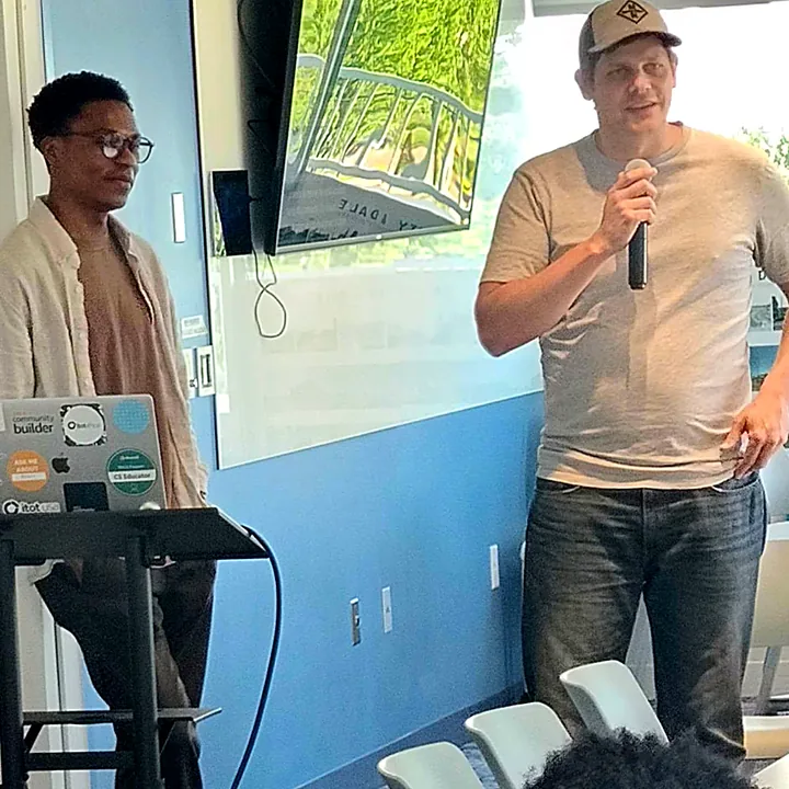 Okademy speakers addressing students during a session